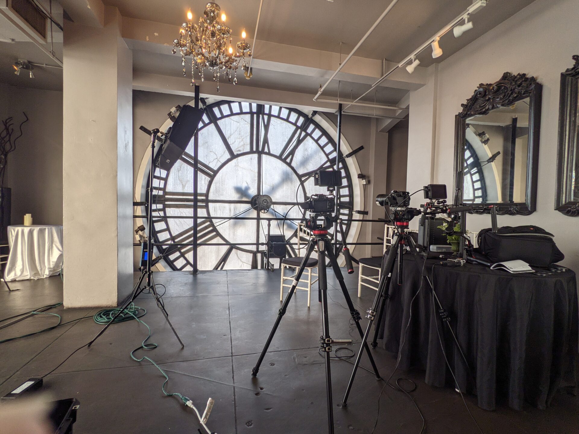 Behind the scenes of video shooting production crew team silhouette and camera equipment in studio.